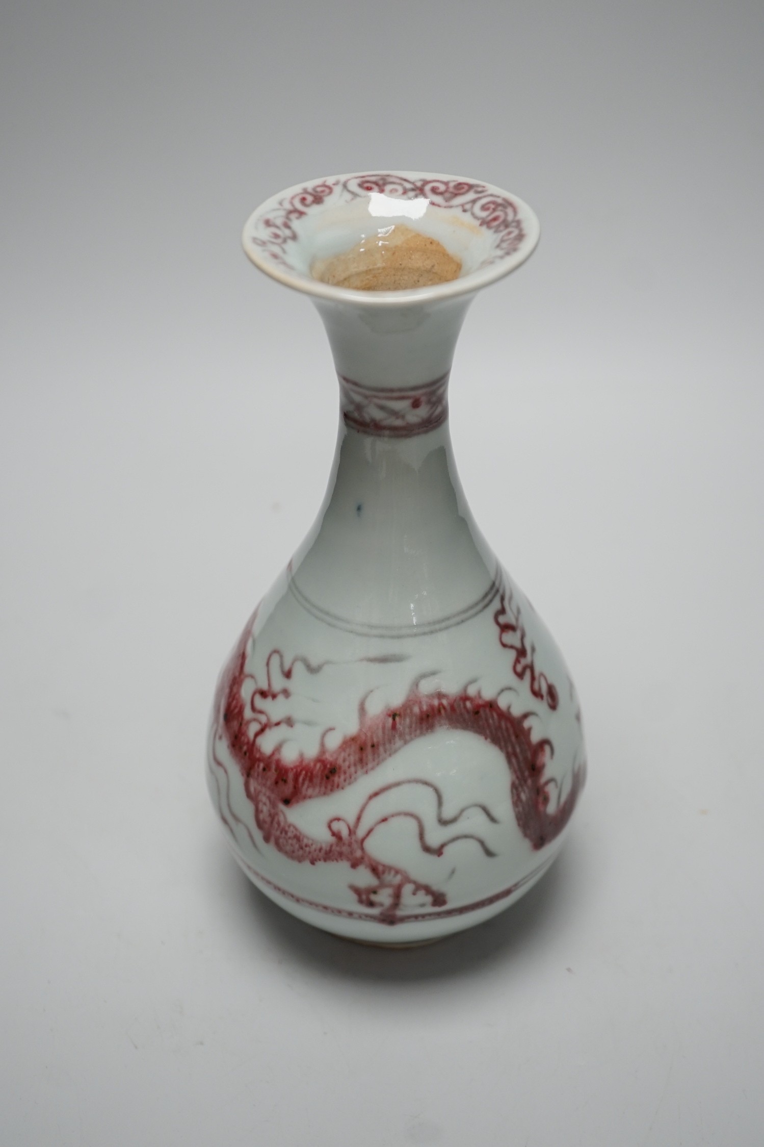 A Chinese underglaze copper red ‘dragon’ vase, 24.5cm